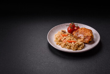Delicious fresh pilaf with rice, carrots, meat, onions, spices and berries