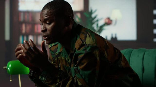 Therapist offering help to army soldier during psychotherapy session, suffering from bipolar disorder and shell shock due to war flashbacks. Distraught military personnel deals with PTSD. Camera A.