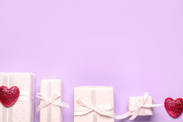 Gift boxes and hearts on lilac background. Valentine's Day celebration