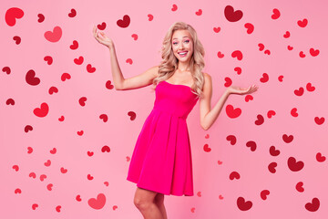 Photo of cheerful adorable slender girl raise arms toothy smile unexpected reaction isolated on pink color background