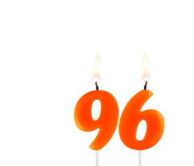 Lit birthday candle - Candle number 96 on white background.