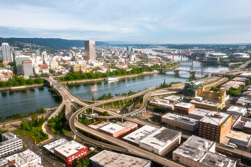 Fototapeta premium Various day and sunset drone scene of Portland Oregon, Willamette river and downtown, Aerial drone footage