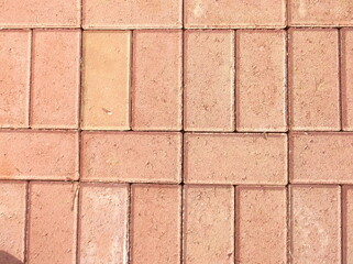 A pattern in textured paver brick is used in patio work.