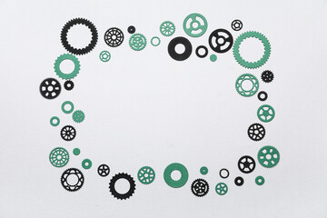 Fototapeta premium Frame made of different paper gears on grey background
