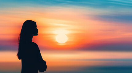 A serene silhouette of a woman gazing at the vibrant sunset on the beach, capturing a perfect moment of peace and reflection.