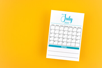 July 2025 calendar page on yellow background.