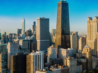 Fototapeta premium Chicago skyline at sunrise, showcasing iconic skyscrapers. Urban architecture. Downtown, Chicago, Illinois, United States Of America