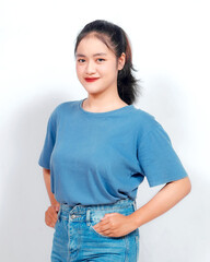 Portrait of a confident smiling girl standing on white background