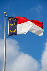 North Carolina state flag waving on the pole in the wind