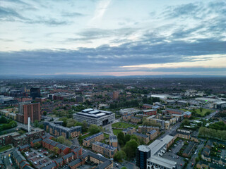 Naklejka premium Aerial View of Buildings at Greater Manchester Central City, Northwest of England, United Kingdom. Aerial View Footage Was Captured with Drone's Camera on May 4th, 2024 During Sunset Time.