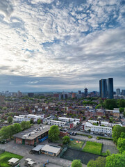 Naklejka premium Aerial View of Buildings at Greater Manchester Central City, Northwest of England, United Kingdom. Aerial View Footage Was Captured with Drone's Camera on May 4th, 2024 During Sunset Time.