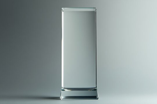 A Tall Clear Glass Rectangular Award Stands Alone