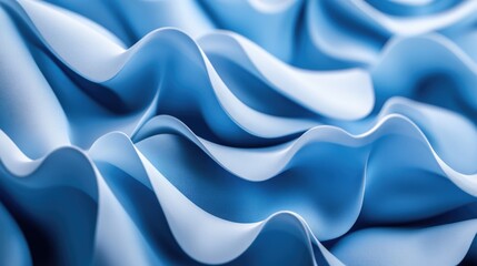 Fototapeta premium A close-up of soft, flowing blue fabric creating elegant waves and textures.