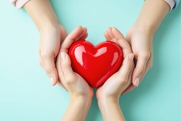 Obraz premium Close-up of hands holding a shiny red heart, symbolizing love, care, and compassion, on a light blue background. Concept of unity and support. Ai generative