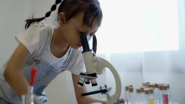 Girl doing science experiment learning concept