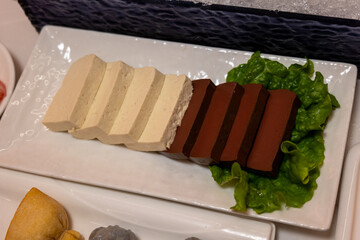 Assorted Tofu Slices on a Serving Plate
