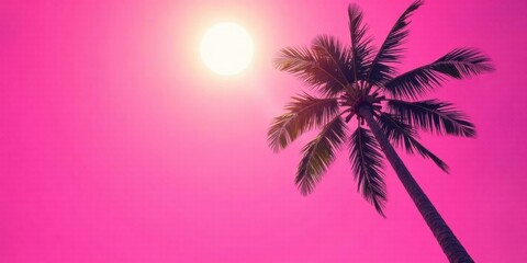 Obraz premium Vibrant Pink Sunset with a Single Palm Tree Silhouette Reaching Towards the Sun