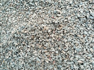 Macadam stone is a small rock resulting from large rock fragments that are broken using a crusher or crushing tool. Macadam stone is usually used as a railroad sleeper or as a layer for hardening land