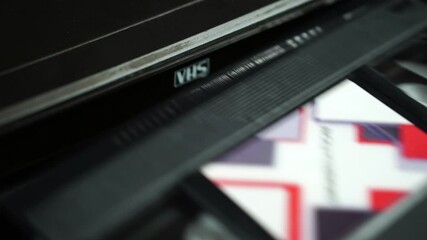 Ejecting Graduation Video Recording on VHS Tape From VCR, Close Up