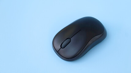 Wireless computer mouse isolated on blue background with clipping path, Selective focus