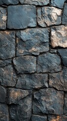 Obraz premium Dark grey stone wall texture, rough surface, irregular shapes, close-up view.