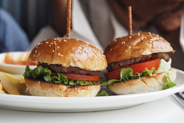 Indulge in Delicious Gourmet Burgers Prepared with Fresh Ingredients