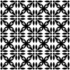 Fototapeta premium Seamless black and white geometric pattern, featuring a symmetrical design with floral motifs. Suitable for backgrounds, wallpapers, textiles, fabrics and various creative projects.