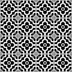 Seamless black and white geometric pattern, featuring a symmetrical design with floral motifs. Suitable for backgrounds, wallpapers, textiles, fabrics and various creative projects.