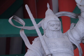 a statue of  chinese guardian symbol close up.