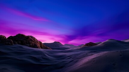 Naklejka premium Serene Desert Landscape Under a Vibrant Sky with Purple and Blue Hues at Dusk Featuring Rocky Formations and Smooth Sand Dunes for Nature Lovers