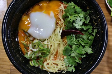 Food delivery: dandan noodle soup with egg (Chinese cuisine)
