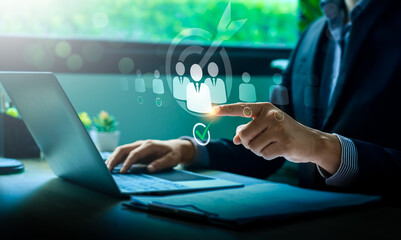 Businessman Selecting Target Audience Using Digital Touchscreen with Virtual Icons Representing Marketing, Recruitment, Customer Relationship Management, and Team Building