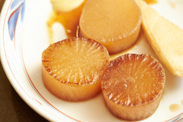 Pickled radish in soy sauce on a plate