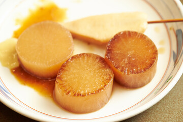 Pickled radish in soy sauce on a plate