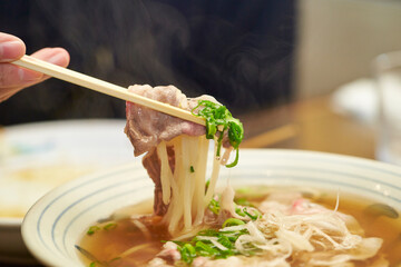 Boiled udon noodles in a bowl
