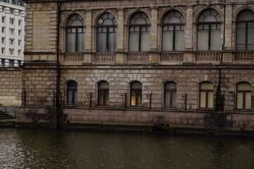 Historic Building Along the Water With Architectural Details in an Urban Setting on a Cloudy Day
