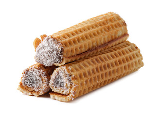 Delicious rolled wafers filled with chocolate cream and coated in coconut flakes displayed on a clean background