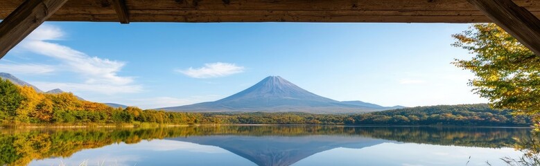 Scenery sightseeing concept. Breathtaking view of a serene lake with mountains reflected in calm waters.