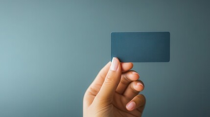 Clean Membership Card in Hand Against Soft Background