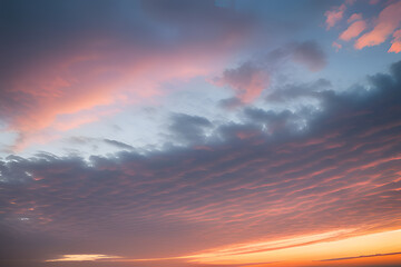 Obraz premium Toned dramatic sky background. Blue gray sky with orange pink clouds. Cloudscape. Fantastic sunset.