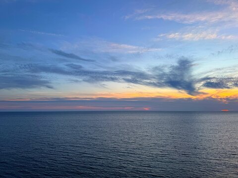 Dusk sky over calm blue sea