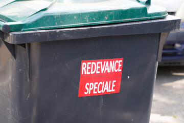 redevance speciale french text sign sticker on trash means charge special fee for garbage...