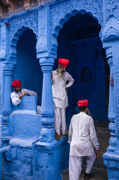 Three indian men in the blue city, Jodhpur, Rajasthan, India