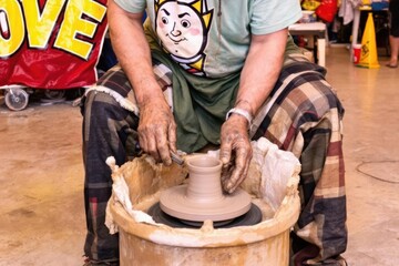 Potter using potters wheel