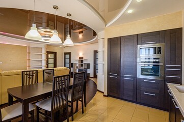 interior apartment kitchen and dining room, refectory area, cooking equipment, table furniture, stove