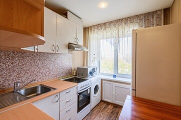 interior apartment kitchen and dining room, refectory area, cooking equipment, table furniture, stove