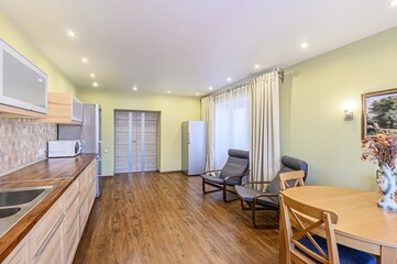 interior apartment kitchen and dining room, refectory area, cooking equipment, table furniture, stove