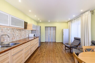 interior apartment kitchen and dining room, refectory area, cooking equipment, table furniture, stove