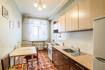 interior apartment kitchen and dining room, refectory area, cooking equipment, table furniture, stove