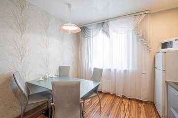 interior apartment kitchen and dining room, refectory area, cooking equipment, table furniture, stove